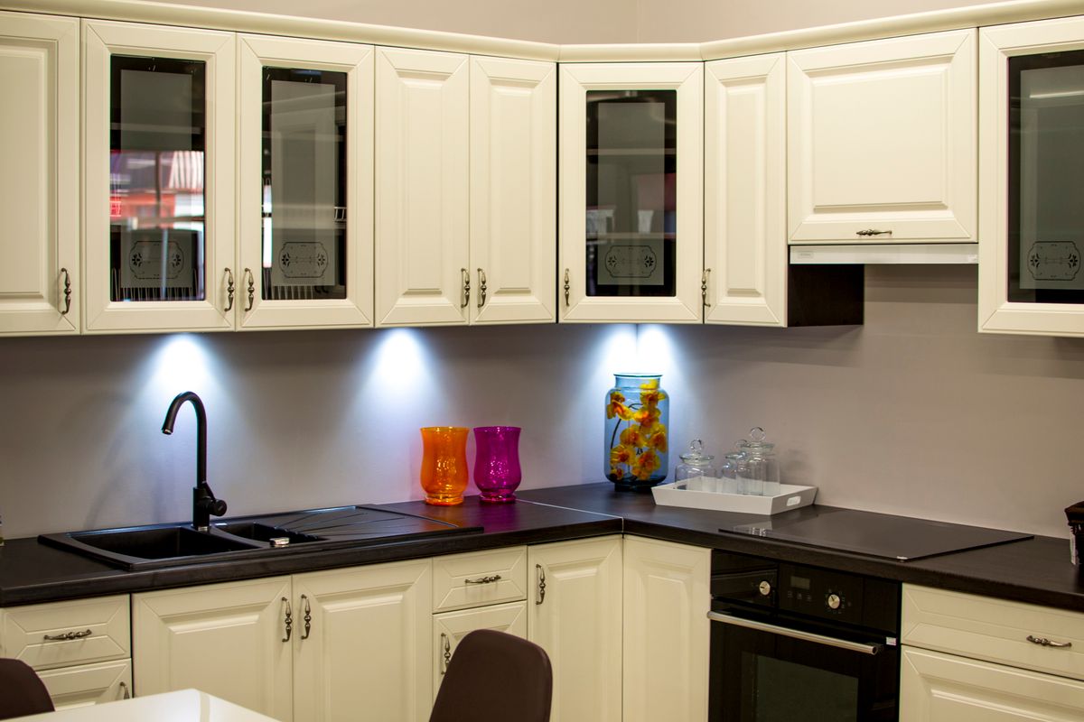 Bright, tidy kitchen with white cabinets and everything in its place