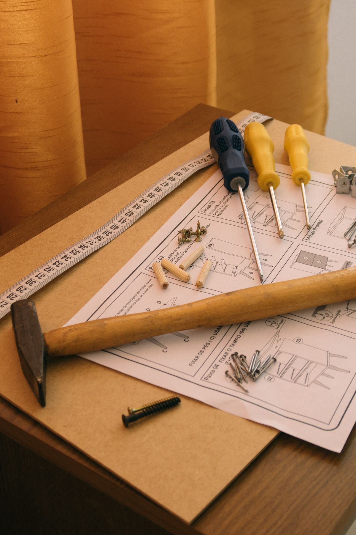 Neatly arranged hand tools and assembly instructions laid out flat